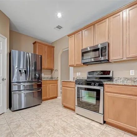 Rent this 4 bed apartment on 21540 Amesbury Meadow Lane in Harris County, TX 77379