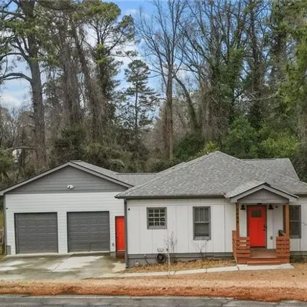 Buy this 4 bed house on 2492 McAfee Road in Candler-McAfee, GA 30032