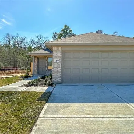 Rent this 3 bed house on Las Cuevas Drive in Conroe, TX 77301