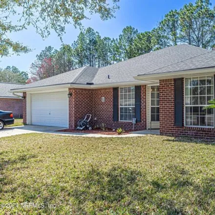 Buy this 4 bed house on 1376 McGirts Creek Drive West in Jacksonville, FL 32221