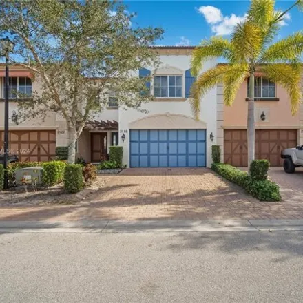 Buy this 3 bed townhouse on Foxtail View Court in West Palm Beach, FL 33411