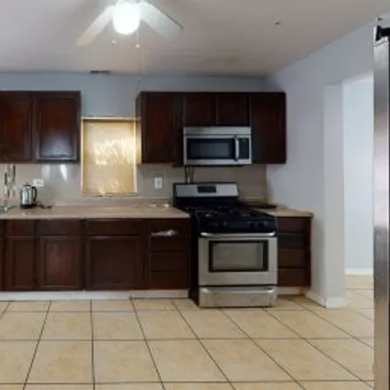 Rent this 3 bed apartment on 3609 South California Avenue in Brighton Park, Chicago