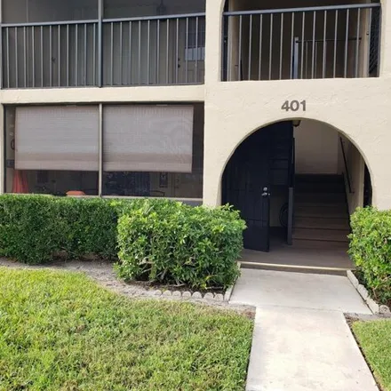 Rent this 2 bed condo on 401 Pine Glen Ln Unit A1 in Greenacres, Florida