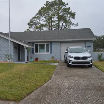 Buy this 3 bed house on 12501 River Mill Drive in Bayonet Point, FL 34667