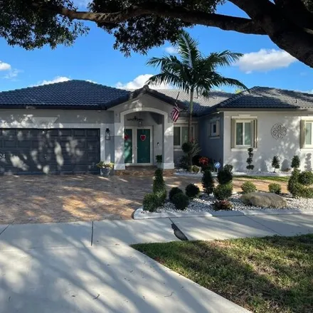 Buy this 4 bed house on 15957 Northwest 77th Place in Miami Lakes, FL 33016