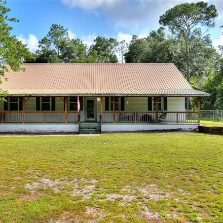 Buy this 6 bed house on 3301 Backwoods Drive in Polk County, FL 33810