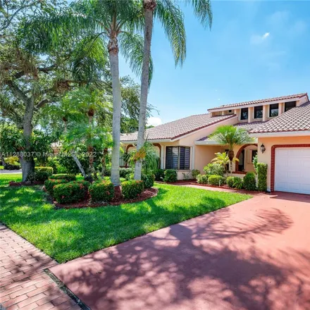 Buy this 4 bed house on Woodmont Country Club in Woodmont Way, Tamarac