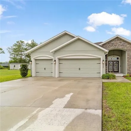 Buy this 5 bed house on 5589 SW 112th St in Ocala, Florida