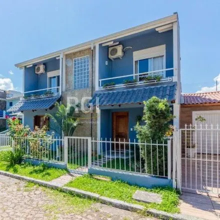Buy this 4 bed house on unnamed road in Guarujá, Porto Alegre - RS