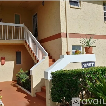 Rent this 2 bed apartment on 1562 SE Royal Green Cir