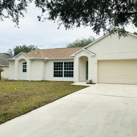 Buy this 4 bed house on 166 Frederica Ave NW in Palm Bay, Florida