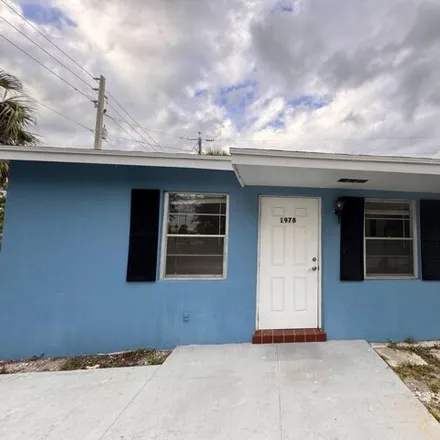 Rent this 2 bed house on 1987 Windsor Drive in Juno Ridge, Palm Beach County