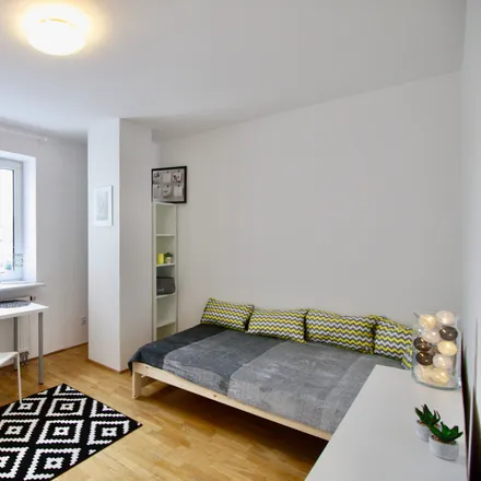 Rent this 4 bed room on Aleja Jana Pawła II 70 in 00-175 Warsaw, Poland