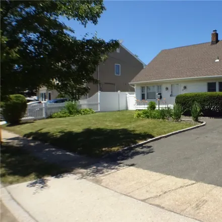 Buy this 4 bed house on 57 Sycamore Lane in Levittown, NY 11756