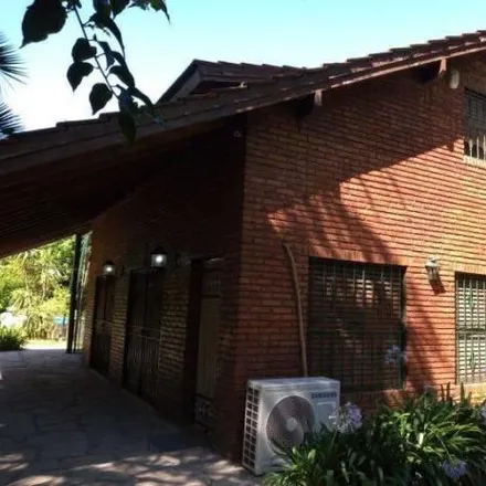 Buy this 3 bed house on Del Malambo in Parque Sumampa, 1715 Buenos Aires
