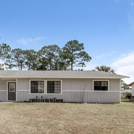Rent this 3 bed house on 429 Tropicaire Avenue Southwest in Palm Bay, FL 32908