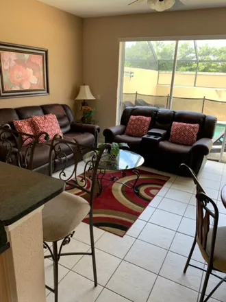 Rent this 3 bed townhouse on Palms Parkway in Osceola County, FL 34747