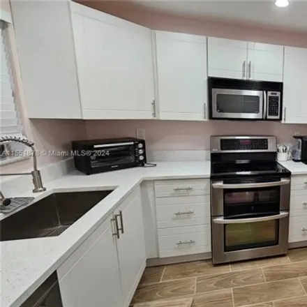 Rent this 2 bed condo on 6058 Northwest 44th Street in Lauderhill, FL 33319