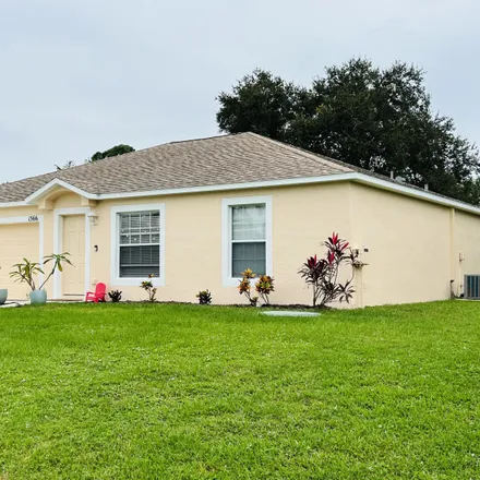 Buy this 3 bed house on 1566 Southwest Bellevue Avenue in Port Saint Lucie, FL 34953