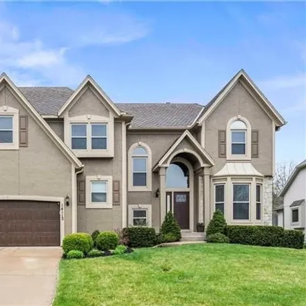 Buy this 4 bed house on 14172 King Street in Overland Park, KS 66221