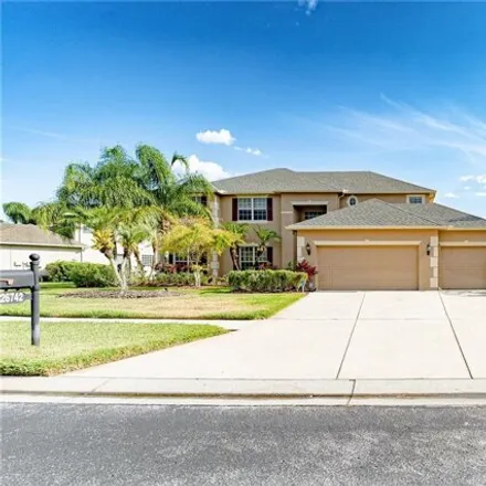 Buy this 5 bed house on 26857 Shoregrass Drive in Seven Oaks, FL 33544