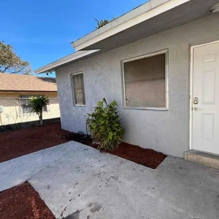 Rent this 3 bed house on 564 Avenue I in Riviera Beach, FL 33404