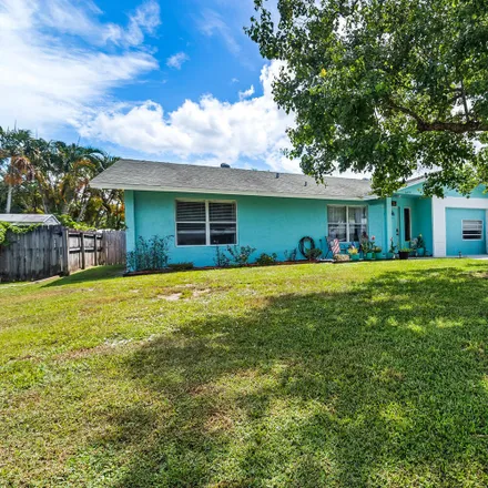 Buy this 4 bed house on 5540 Indigo Avenue in Coral Gardens, Martin County