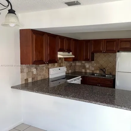 Rent this 3 bed townhouse on 1120 Southeast 13th Terrace in Homestead, FL 33035