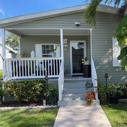 Buy this studio apartment on 2567 Meadows Circle East in Palm Beach Gardens, FL 33410