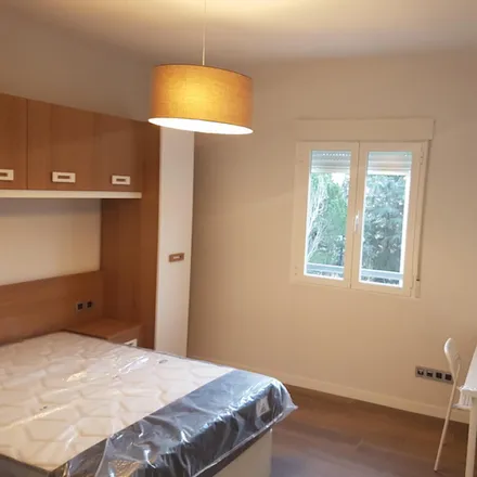Rent this 7 bed room on Calle Sanchidrián in 28024 Madrid, Spain