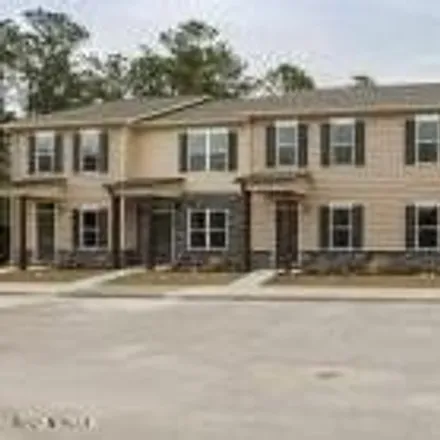 Rent this 2 bed townhouse on Henderson Road in Piney Green, NC 28544