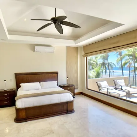 Rent this 4 bed condo on Playa Hermosa in Puntarenas, Costa Rica