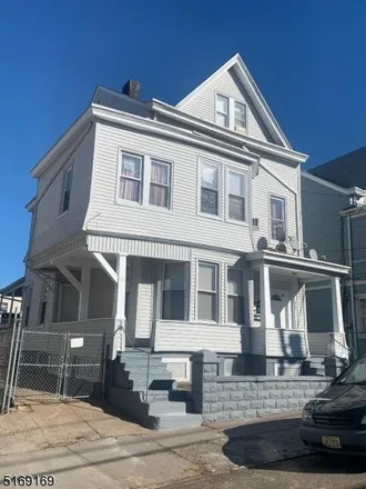 Buy this 8 bed townhouse on 68 Jasper Street in Paterson, NJ 07522