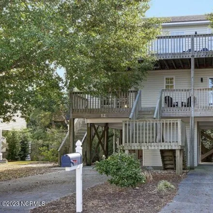 Buy this 4 bed house on 1 South Oak Drive in Surf City, NC 28445