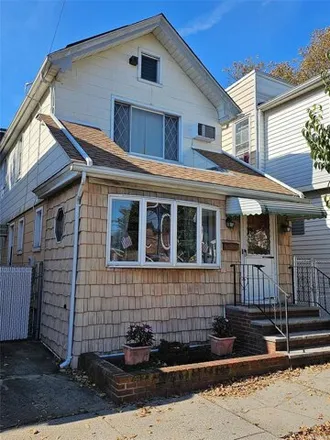 Buy this 3 bed house on 91-06 79th Street in New York, NY 11421