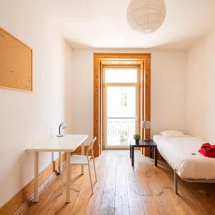 Rent this 4 bed room on Taberna Albricoque in Rua dos Caminhos de Ferro, 1100-108 Lisbon