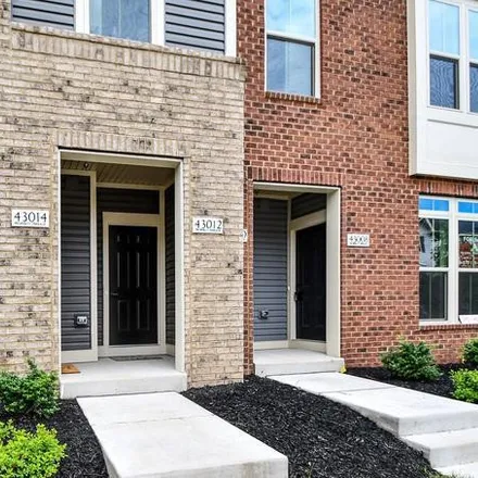 Rent this 3 bed townhouse on Dulles Yard Drive in Loudoun County, VA 20166