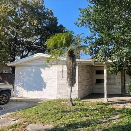Buy this 3 bed house on 5033 Mile Stretch Drive in Holiday, FL 34690