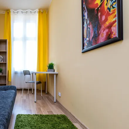 Rent this 5 bed room on Święty Marcin 76 in 61-809 Poznań, Poland