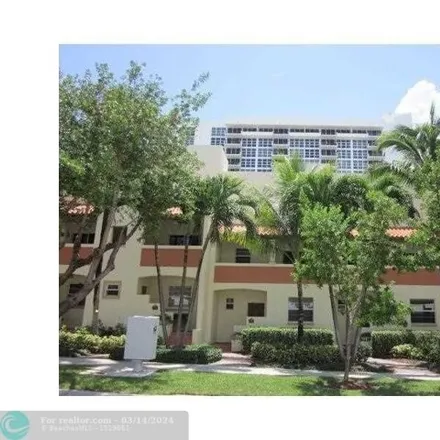 Rent this 2 bed townhouse on 3350 Northeast 6th Street in Pinehurst Village, Pompano Beach