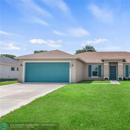 Buy this 4 bed house on 1248 Southwest Mancuso Avenue in Port Saint Lucie, FL 34953