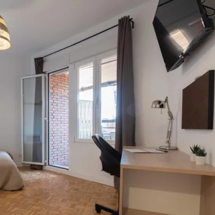 Rent this 6 bed room on Calle de los Cuatro Amigos in 28046 Madrid, Spain