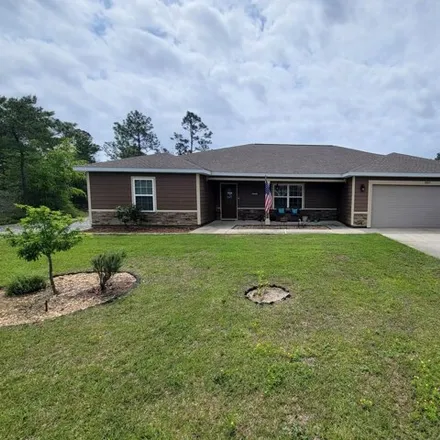 Rent this 4 bed house on 8611 Estrada Street in Navarre, FL 32566