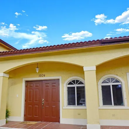 Rent this 2 bed townhouse on 18935 NW 85th Ave in Hialeah, FL 33015