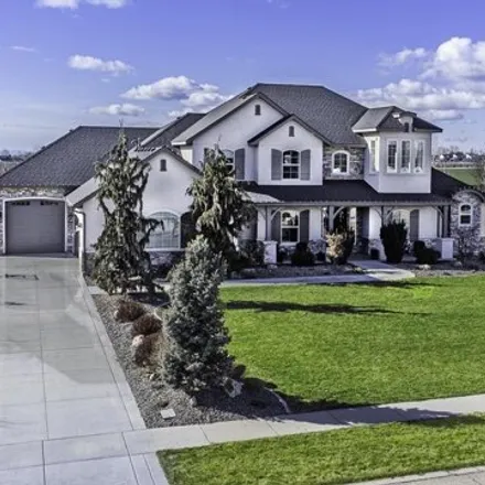 Buy this 4 bed house on 7127 South Pear Blossom Way in Meridian, ID 83642