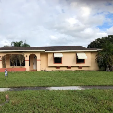 Rent this 3 bed house on 325 Northeast Orchard Street in Port Saint Lucie, FL 34983