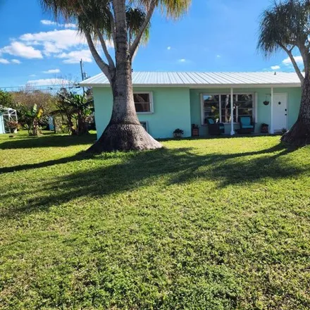 Rent this 3 bed house on 3999 Southeast Kubin Avenue in Port Salerno, FL 34997