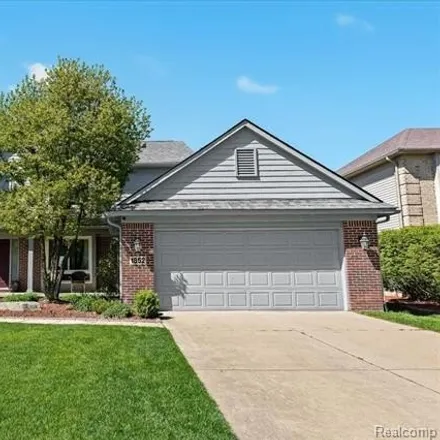 Buy this 4 bed house on 1854 Twin Sun Circle in Commerce Charter Township, MI 48390