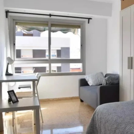 Rent this 8 bed room on Amistat in Carrer dels Sants Just i Pastor, 46021 Valencia
