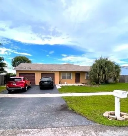 Rent this 3 bed house on 9605 Richmond Circle in Palm Beach County, FL 33434